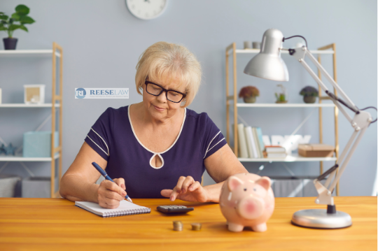Woman reviewing retirement savings and using a calculator while planning finances, illustrating how asset division attorneys in Fairfax, VA, can help protect retirement accounts during divorce.